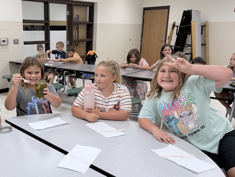 3rd grade students tasting pickles they canned