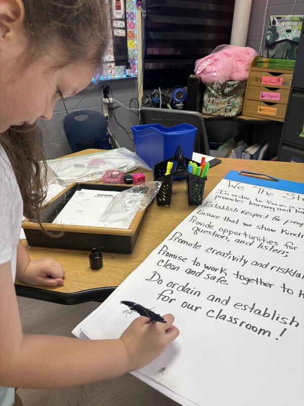 1st Grade signing their classroom constituioln
