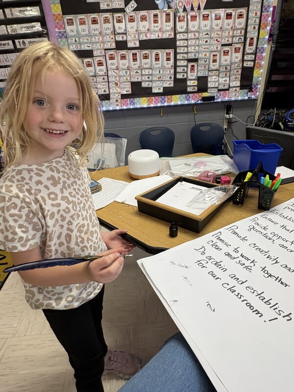 1st Grade signing their classroom constituioln