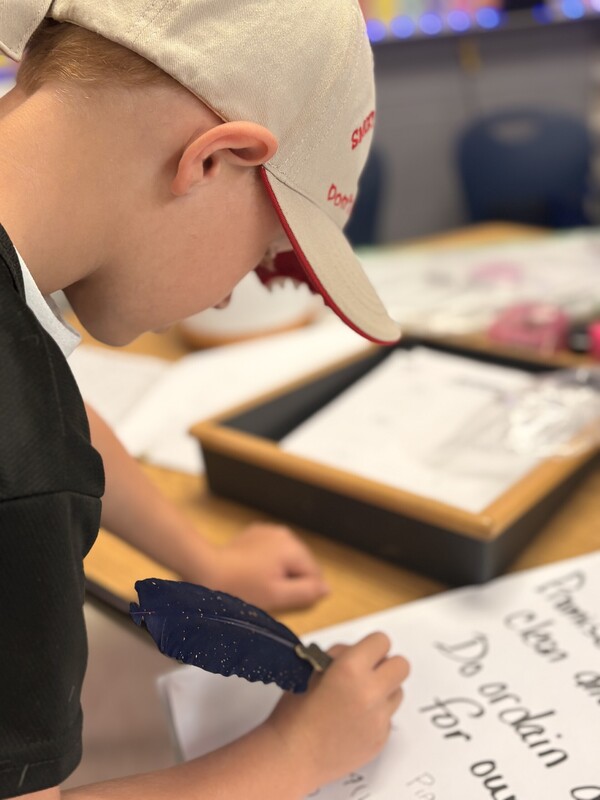 1st Grade signing their classroom constituioln