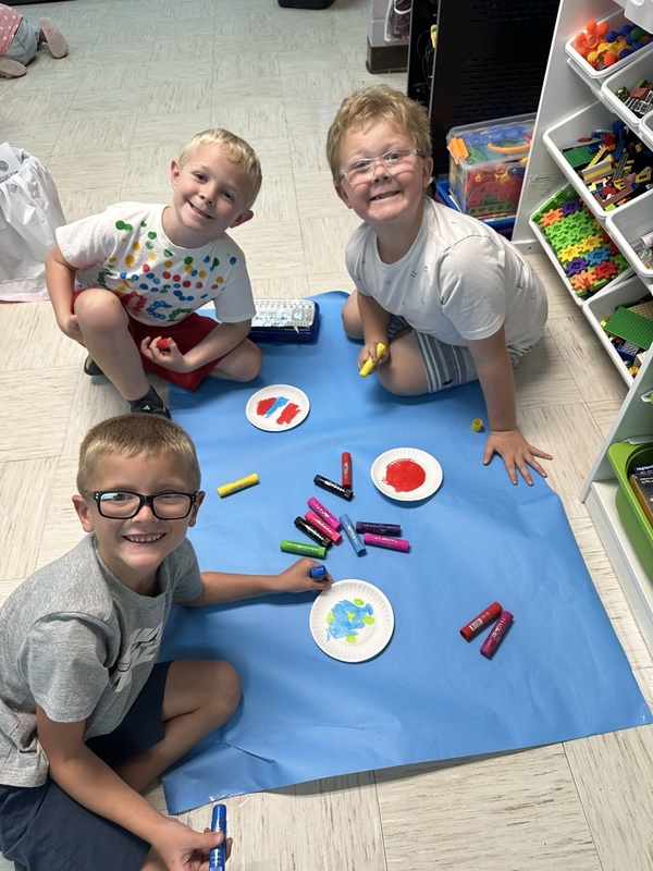 Miss Delk’s students making dot art