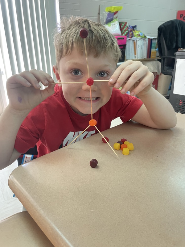 Mrs. Gray’s students posing with dot creation