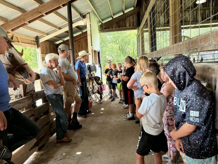 Mrs. Mandy Looper and Lillie Looper Farms leading a station at Farm Bureau Ag Day