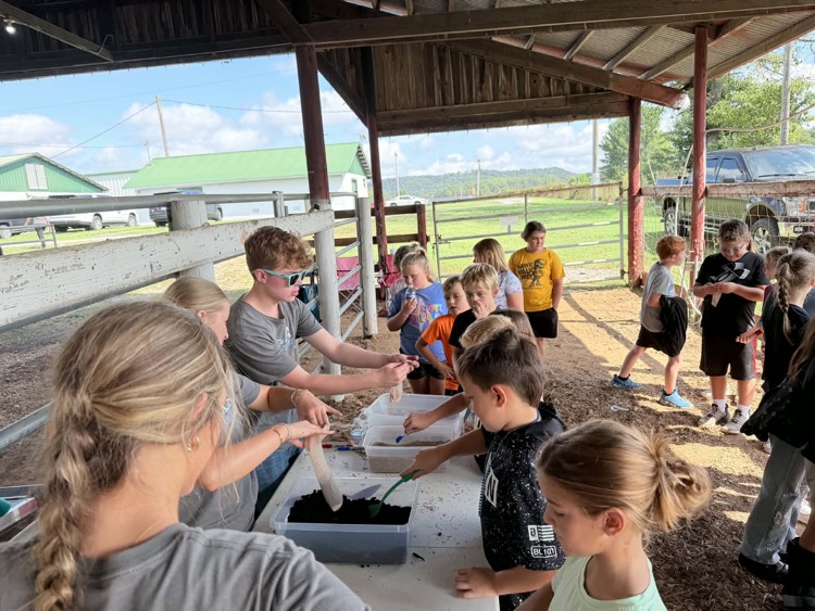3rd grade students rotate through 13 stations at Farm Bureau’s Ag Day