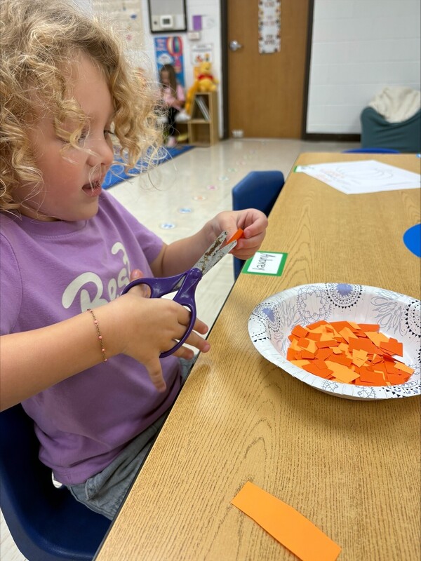 Pre-K practicing their cutting skills