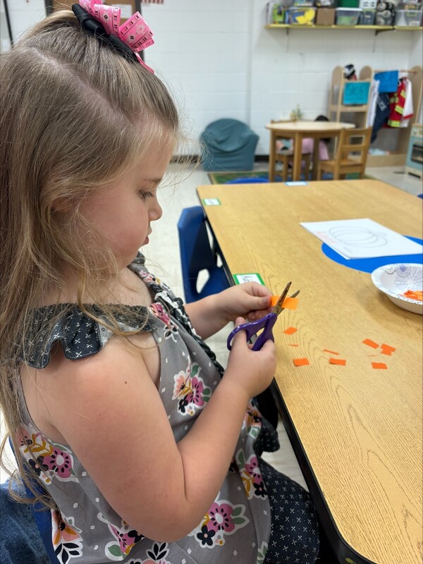 Pre-K practicing their cutting skills
