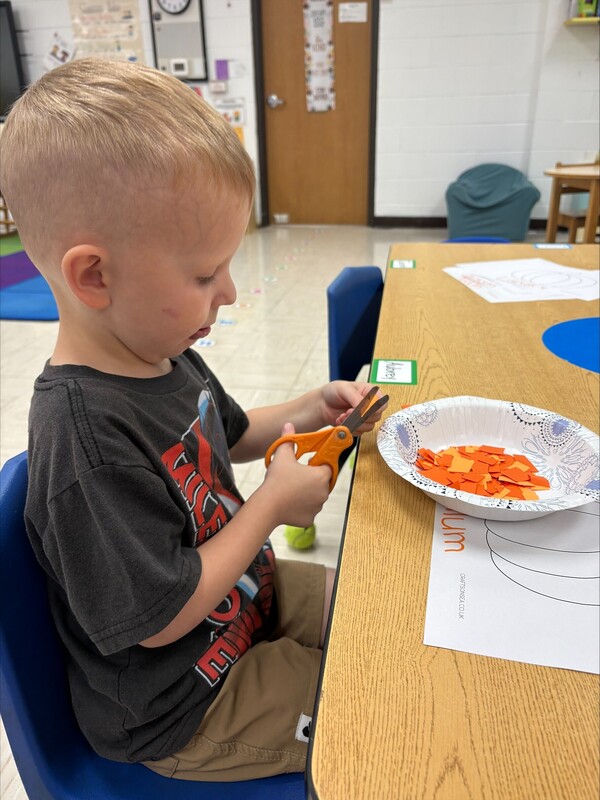 Pre-K practicing their cutting skills