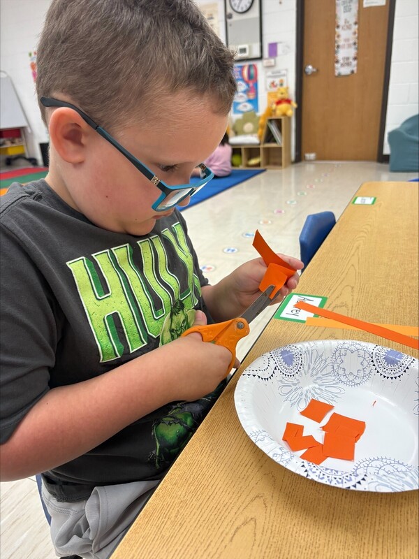 Pre-K practicing their cutting skills