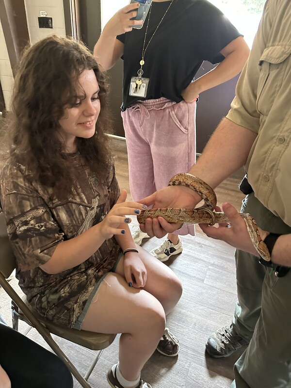 7th grade student with snake