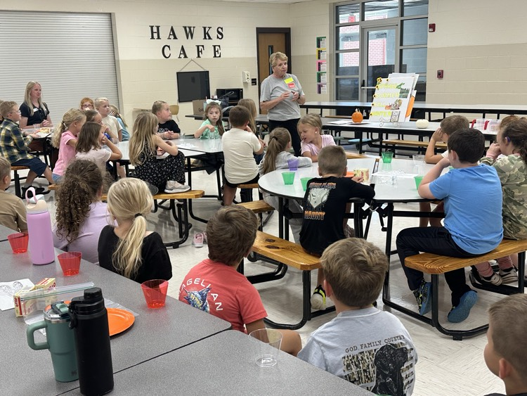 Mrs. Linda Clouse shares pumpkin story with first grade.
