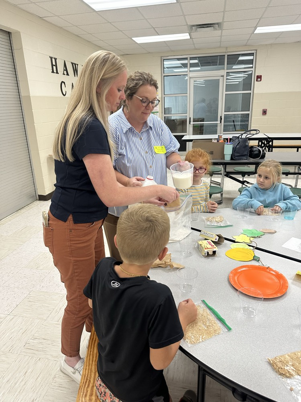 The Farm Bureau Ladies demonstrate making pumpkin pie in a bag.