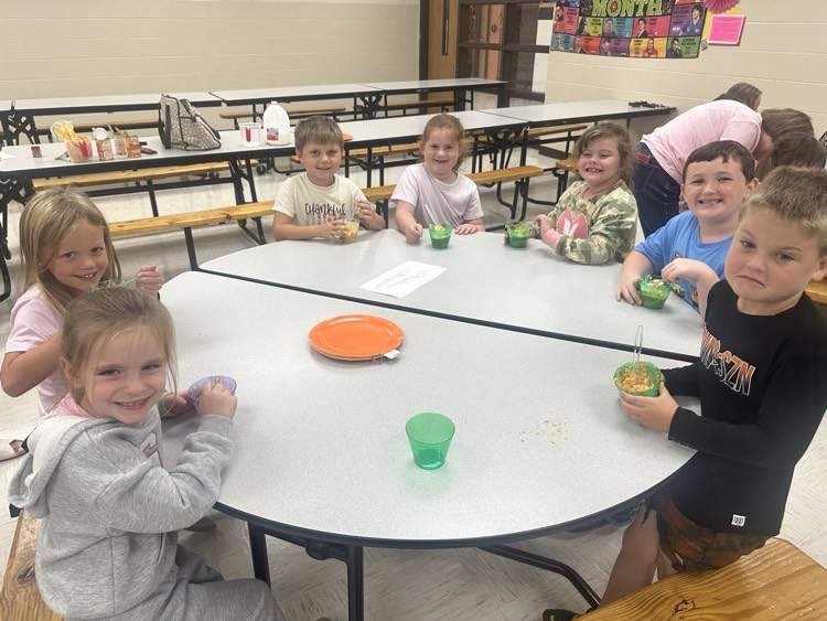 first graders trying pumpkin pie