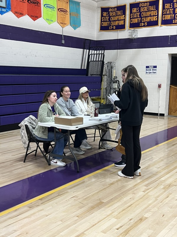 student getting packet