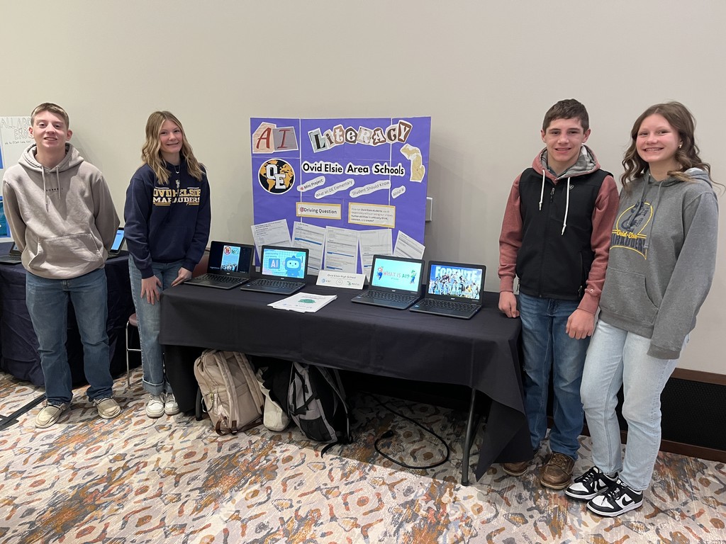 Students pose by their projects.