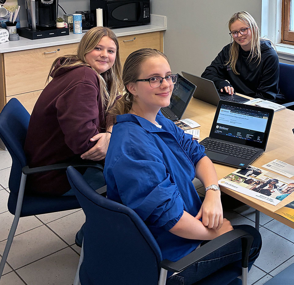 Three high school students complete online applications to Herkimer College