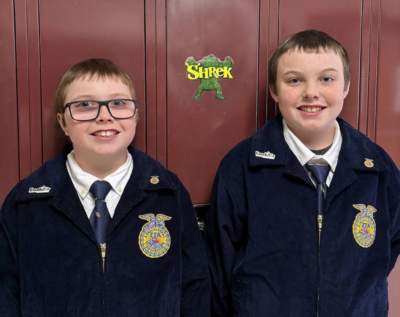 two ODY students wearing FFA gear smile for the camera