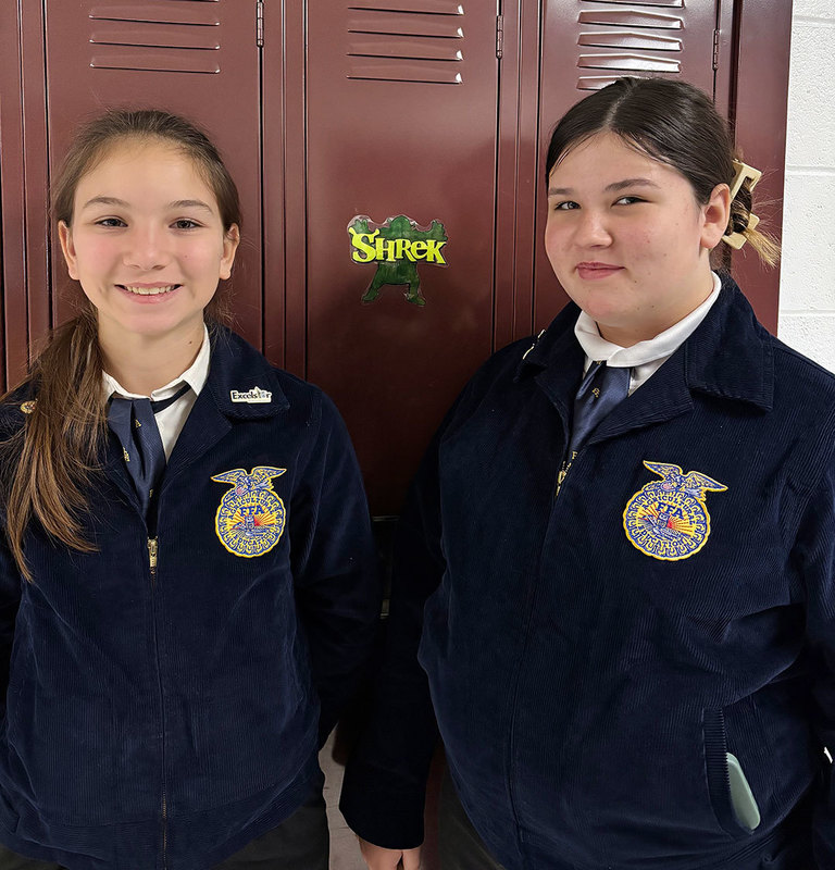 two ODY students wearing FFA gear smile for the camera