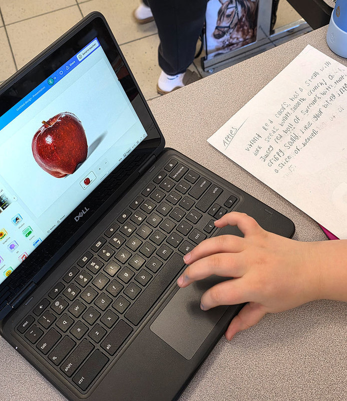 a student types words on a laptop  screen