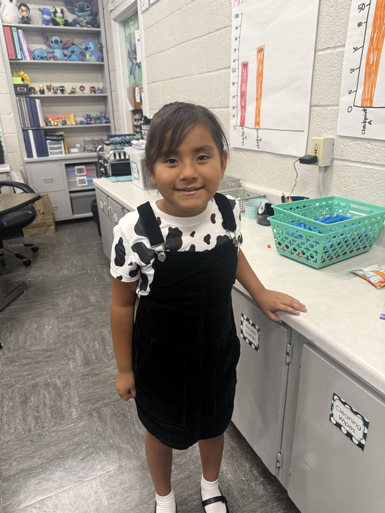 student in cow shirt