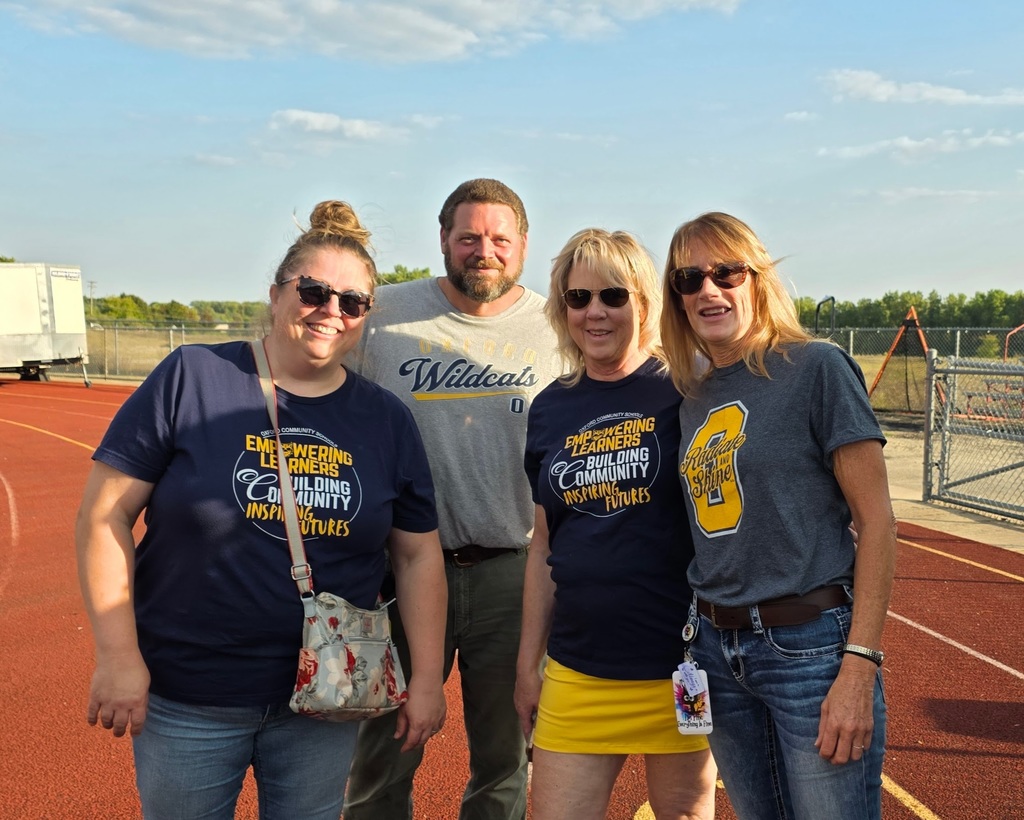 staff smiling at the camera