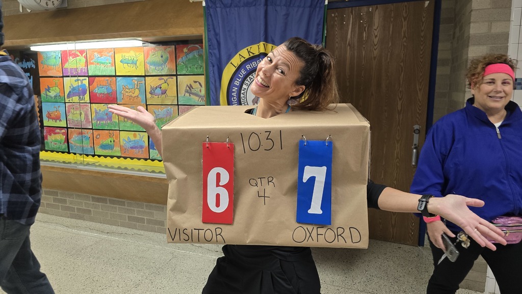 Teacher with 67 scoreboard costume