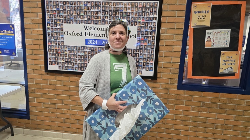 Teacher in costume with 7 shirt and tissues for "Sick 7"