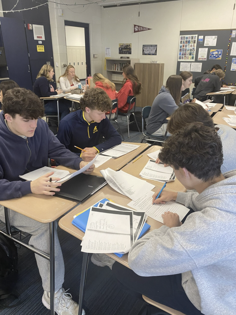 students writing things down