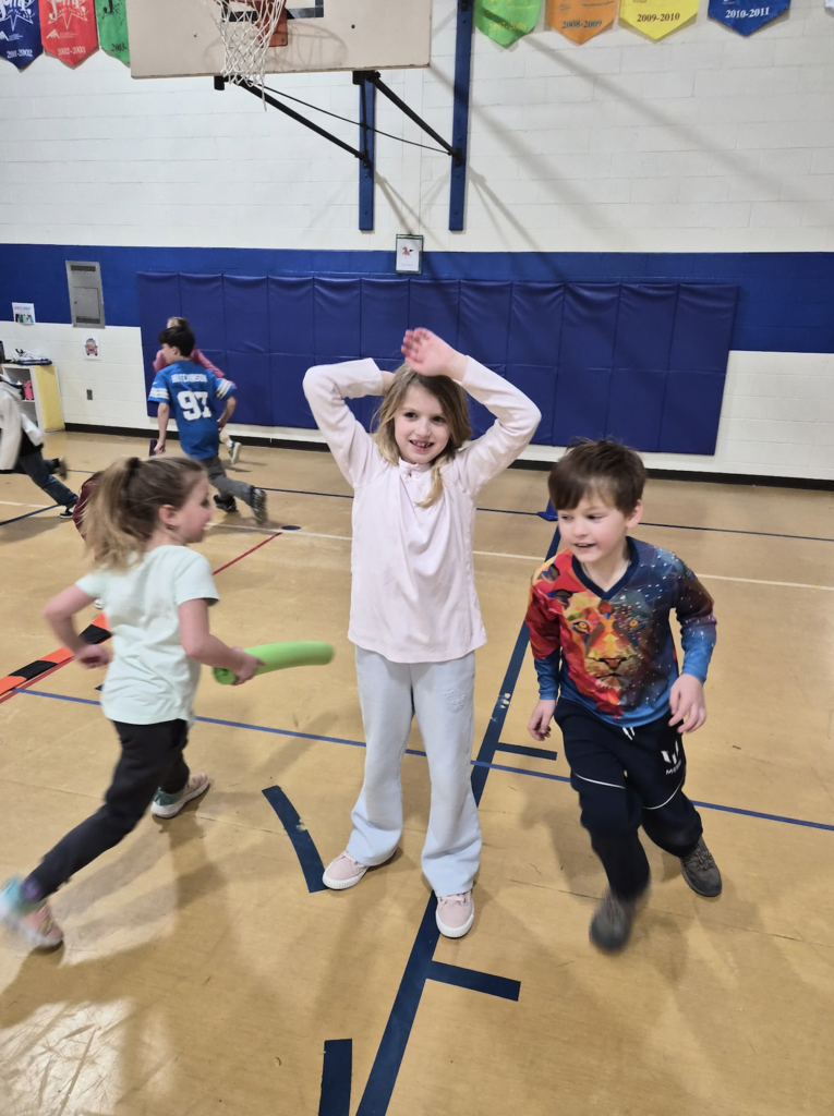 kids running around in a circle