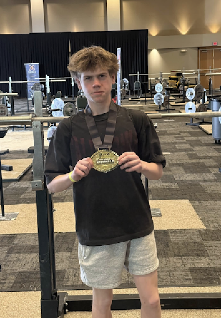 Ryan Alexander holding up metal