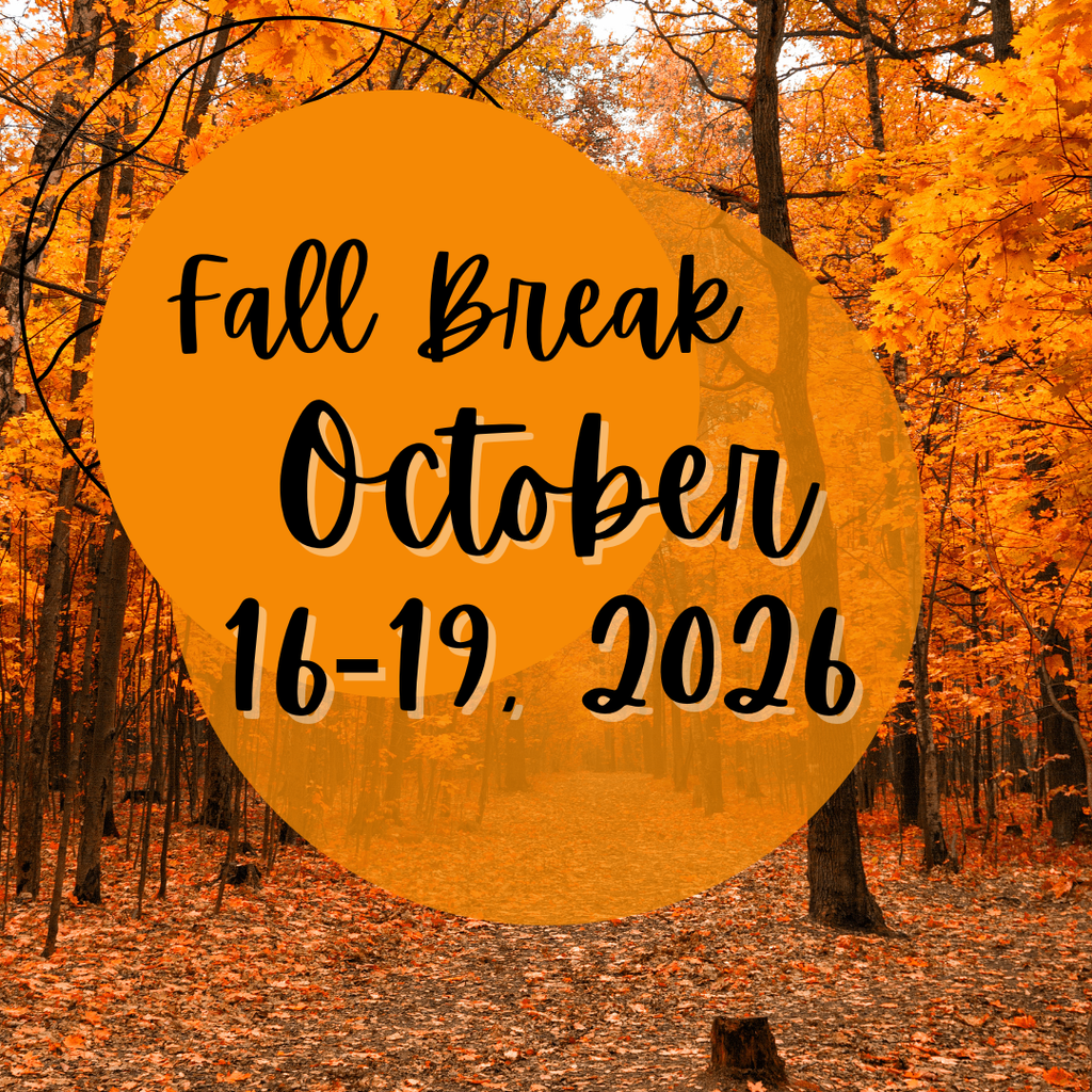 Autumn-themed Fall Break announcement graphic featuring a forest path surrounded by vibrant orange and yellow fall foliage. Overlaid translucent orange circles contain black script text reading: “Fall Break October 16–19, 2026.” The warm seasonal design highlights colorful autumn leaves, tall trees, and a peaceful woodland setting.