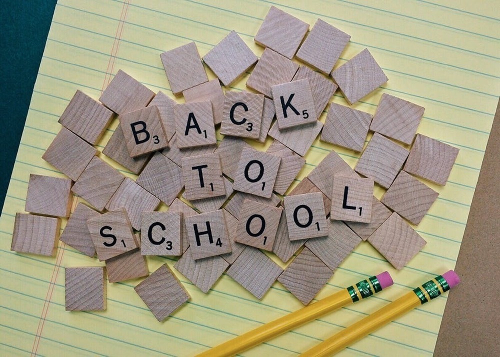scrabble tiles that spell "Back to School"