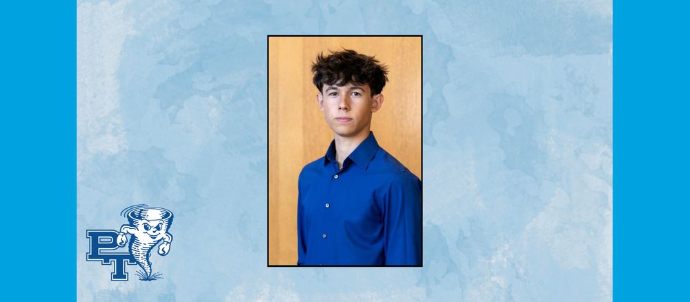 a young man in a blue shirt