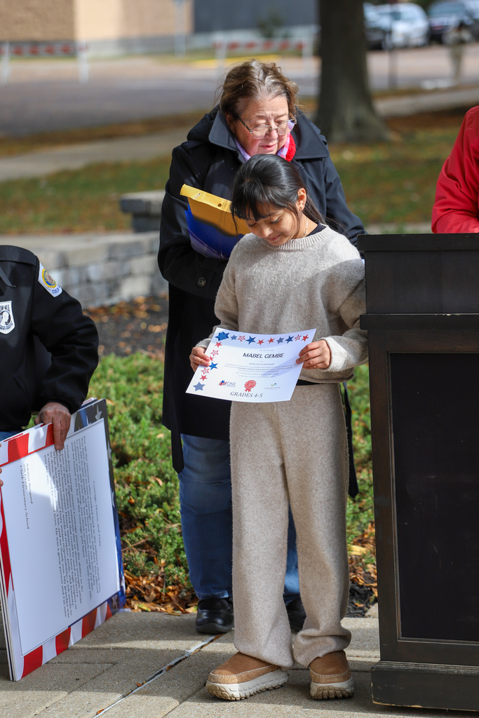 students holding certificates
