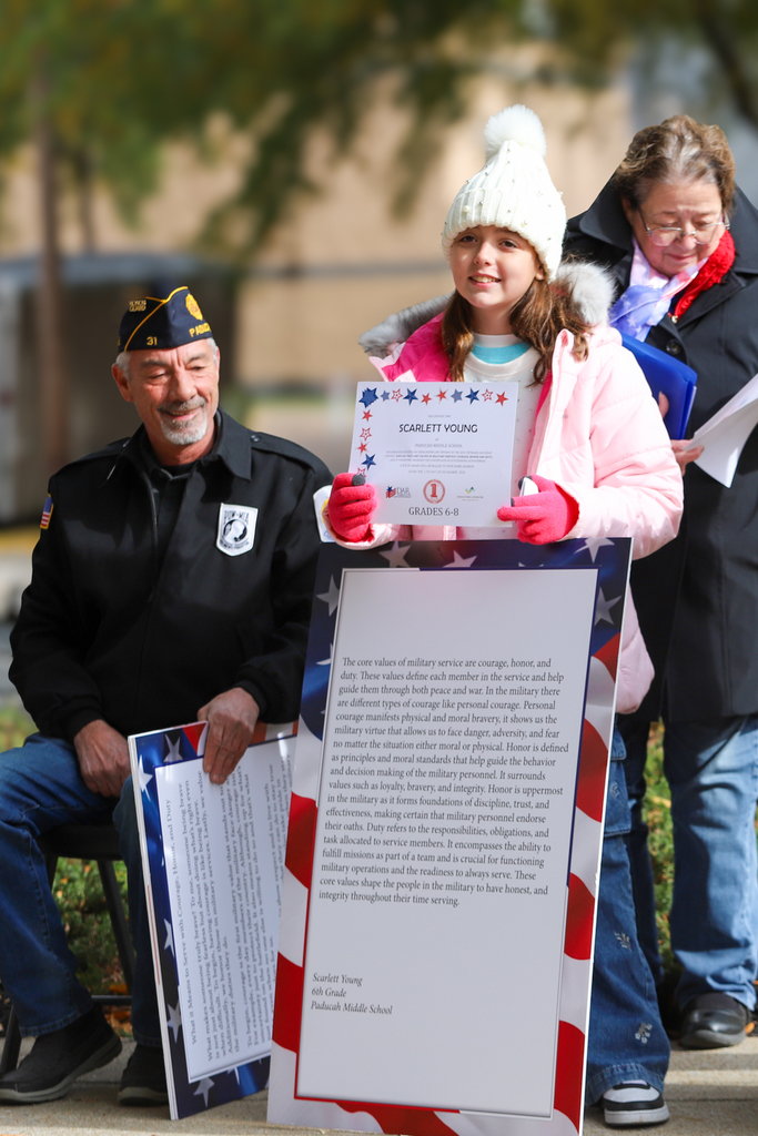 students holding certificates