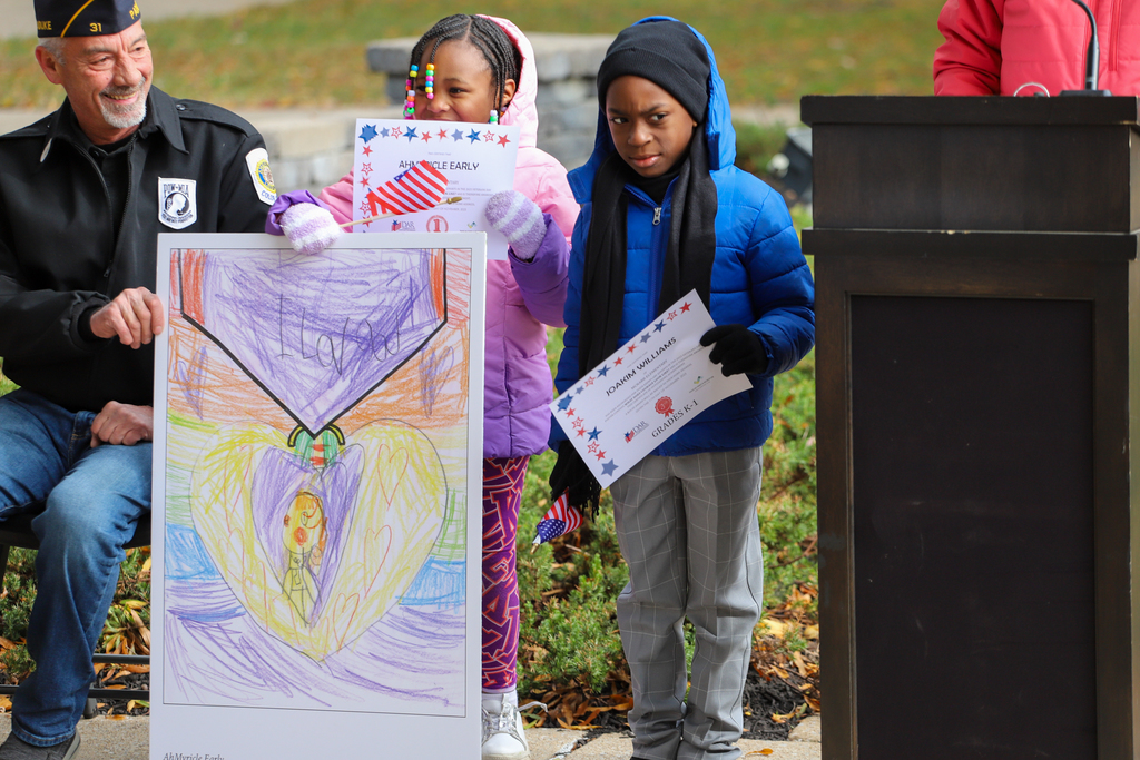 students holding certificates