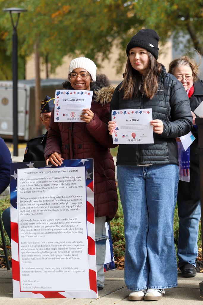 students holding certificates