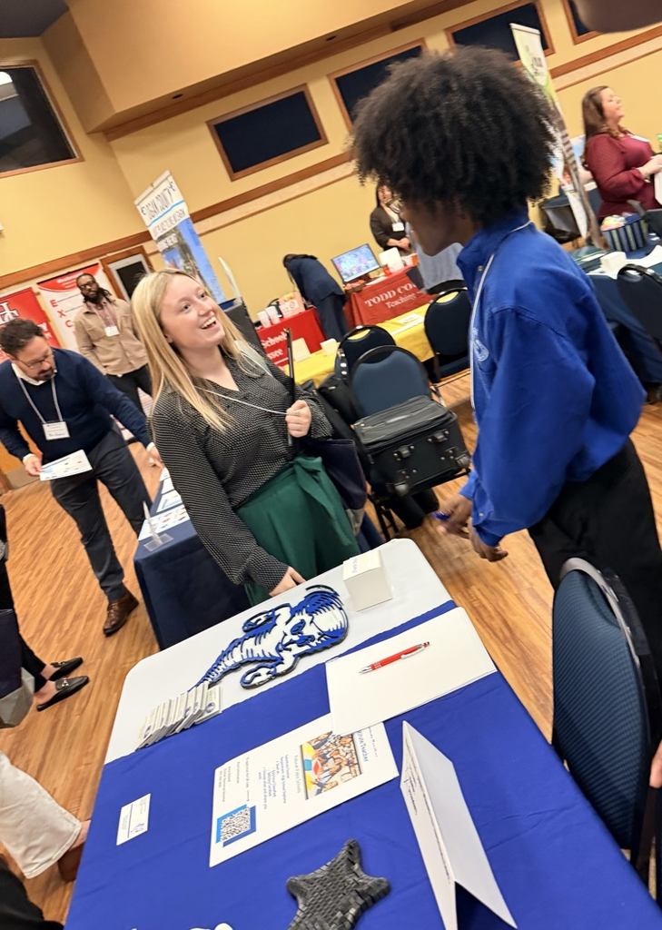 A teenager speaking with a woman.