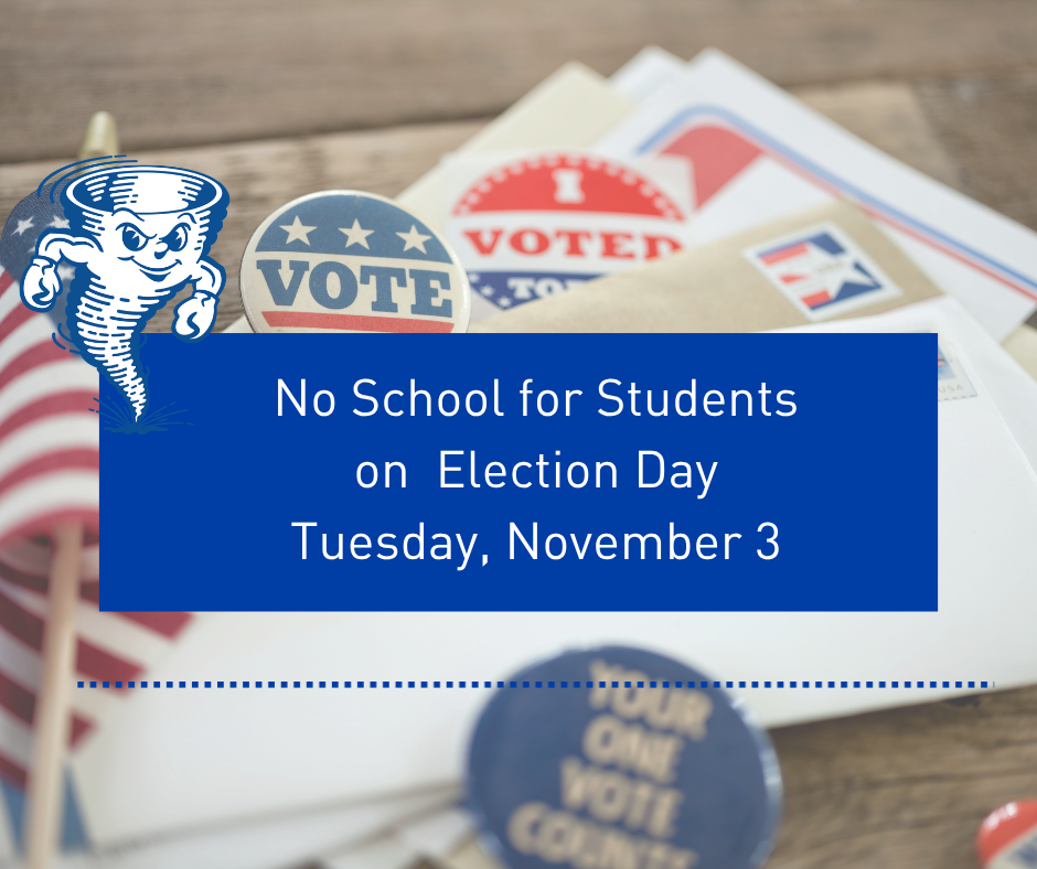 Paper mail, pins, and a small American flag on a wooden table with a blue announcement of no school on election day.