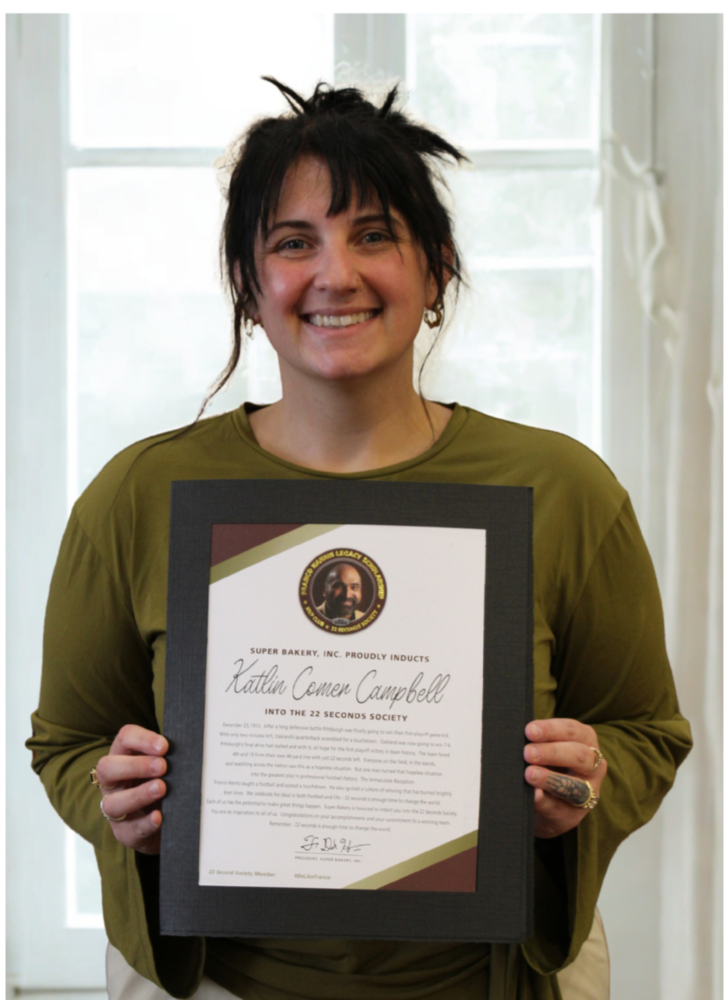 Kate Campbell holding her certificate