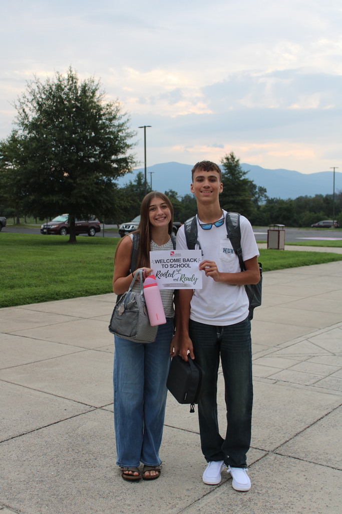 Couple walking into school for the first day