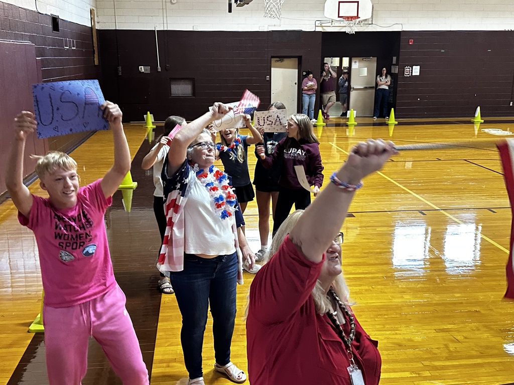 8th grade students and teachers getting the crowd involved
