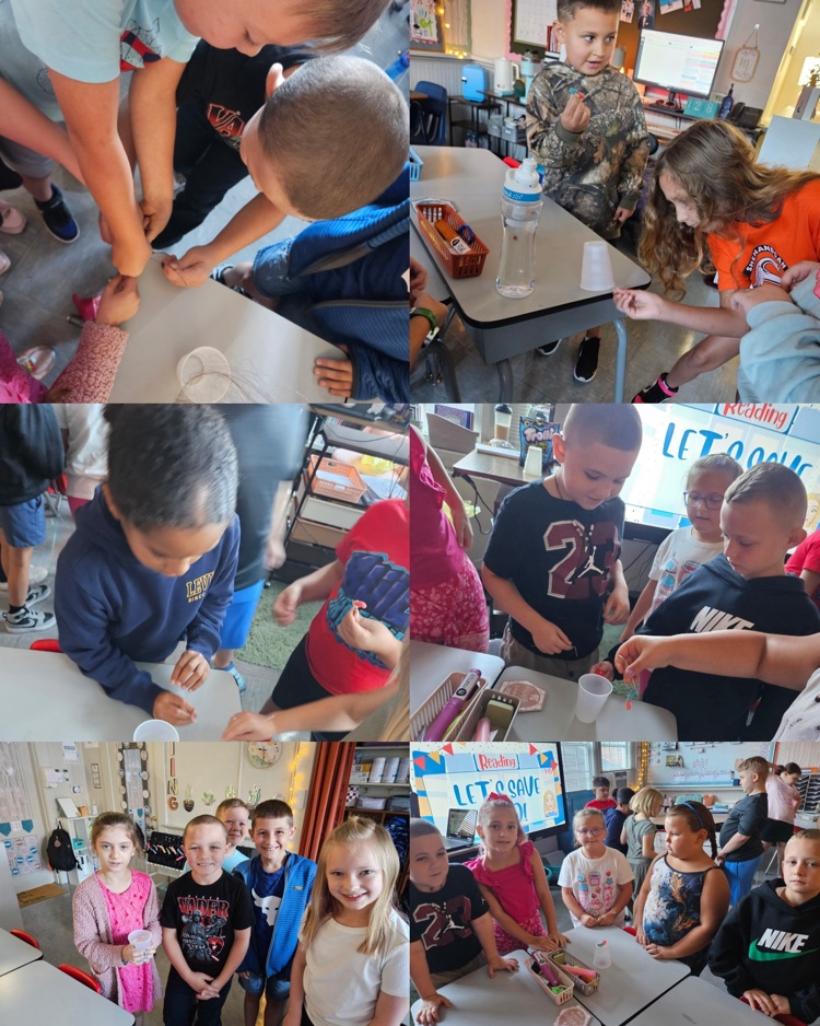  Third graders work in teams using four paper clips and no hands to complete the “Save Fred” STEM challenge.