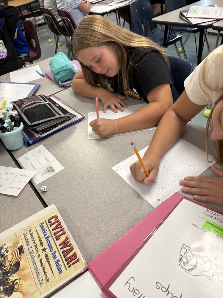5th graders playing a math game