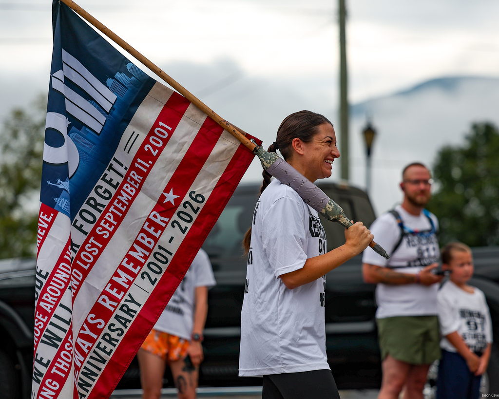 Officer Jenkins carrying 9/11 flag