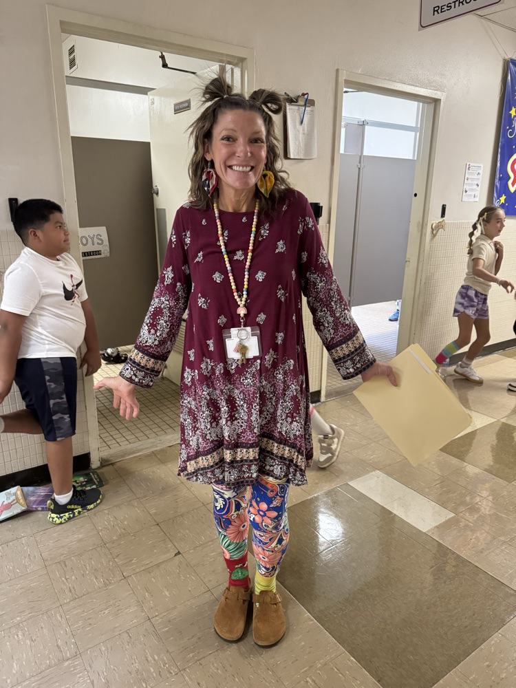 teacher with crazy hair and mixed matched