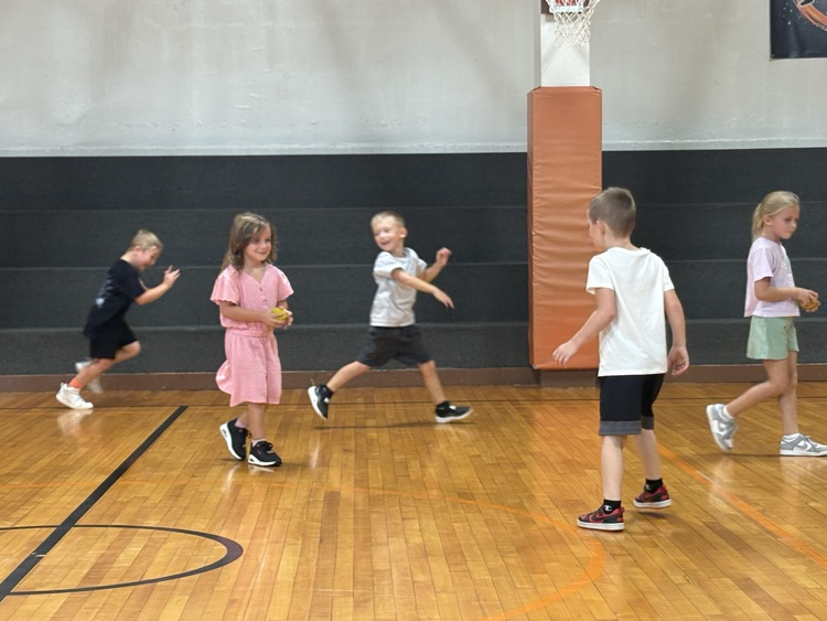 Group of first graders staying active in PE.