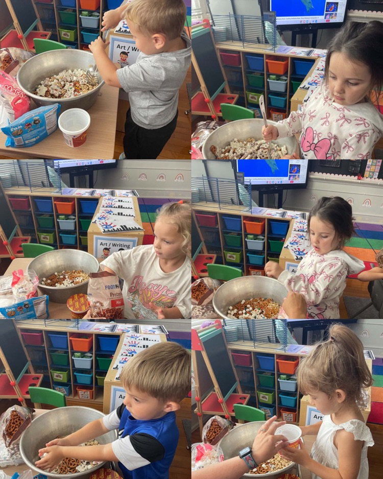 A group of pre-k students working together to make a snack mix.