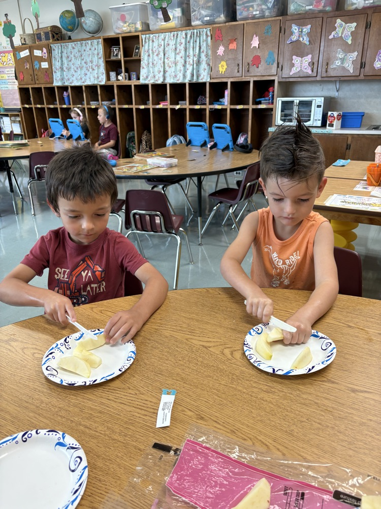 kids cutting apples