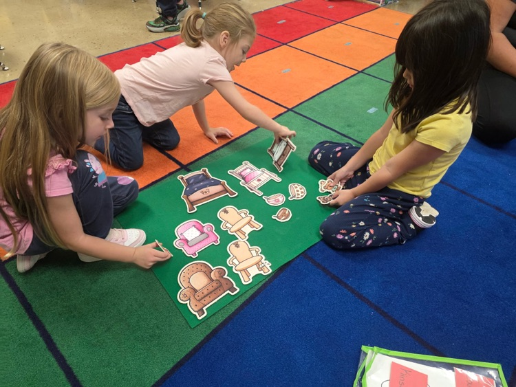 preschoolers working on a story board
