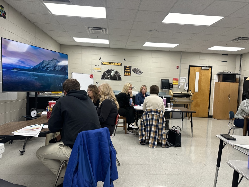 Staff reviewing due process folders with KEDC consultants